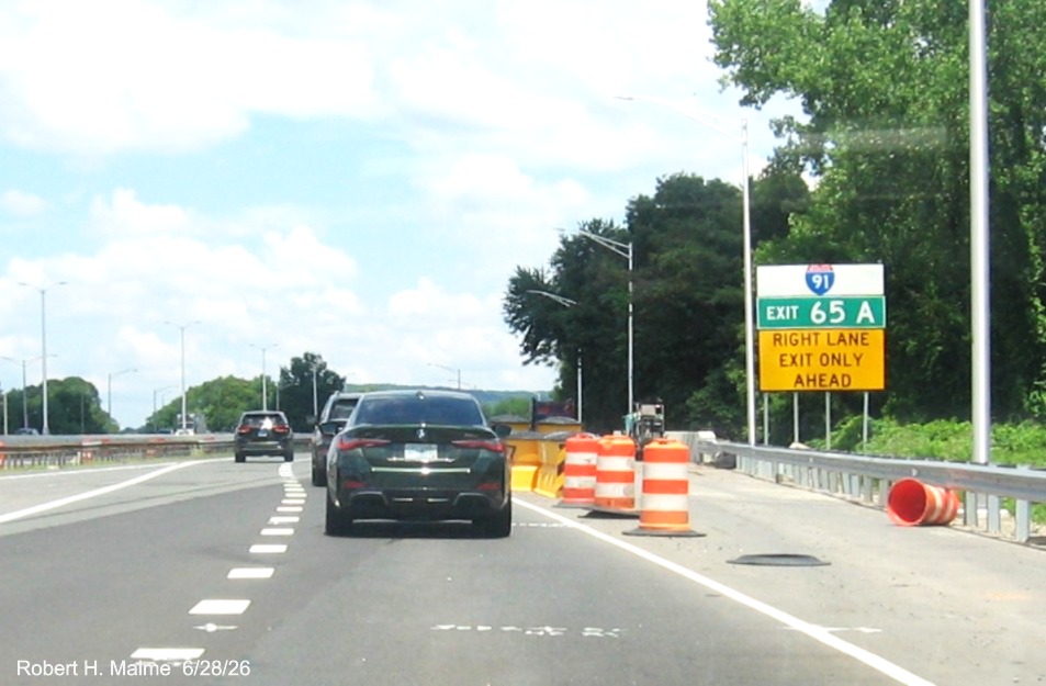 Image of auxiliary sign for the I-91 North exit, with new milepost based exit number  
 on CT 15 North/Cross Parkway in Meriden, June 2026