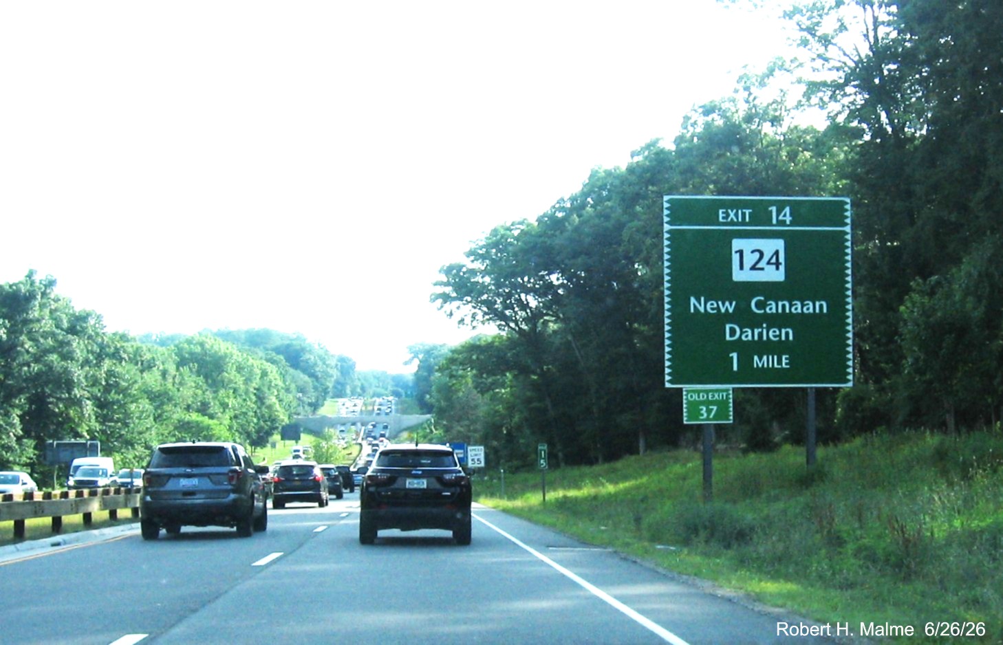 Image of 1/2 Mile advance sign for the CT 124 exit, now with new milepost based exit 
 number on CT 15 South/Merritt Parkway in New Canaan