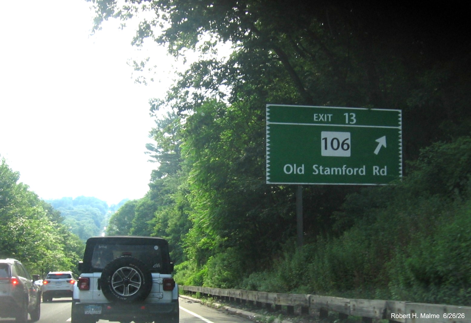 Image of ground mounted ramp sign for the CT 106 exit, now with new milepost based exit 
 number on CT 15 South/Merritt Parkway in New Canaan