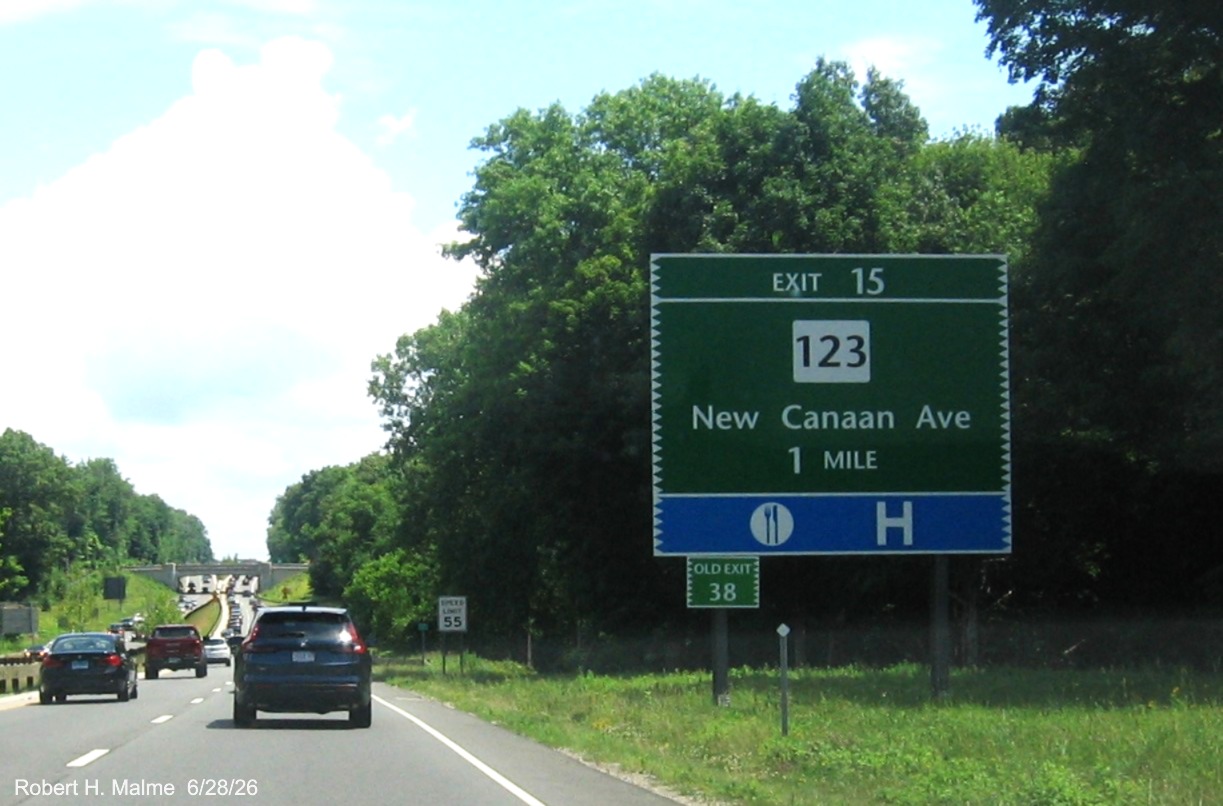 Image of 1 Mile advance sign for the CT 123 exit, now with new milepost based exit number 
 and small Old Exit 38 sign on support post on CT 15 North/Merritt Parkway in Norwalk