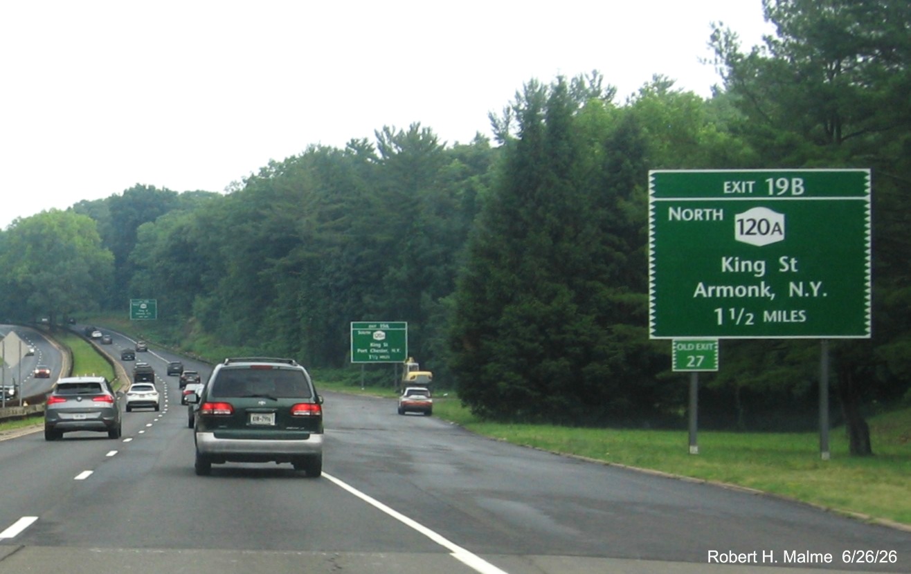 Image of 1 1/2 mile advance sign for North NY 120A exit, with new NY milepost based number on 
 CT 15 South/Merritt Parkway in Greenwich