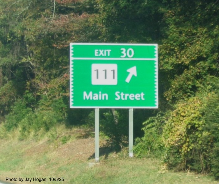 Image of ground mounted ramp sign for the CT 111/Main Street exit, with new milepost 
 based exit on CT 15 South/Merritt Parkway in Bridgeport, by Jay Hogan, October 2025