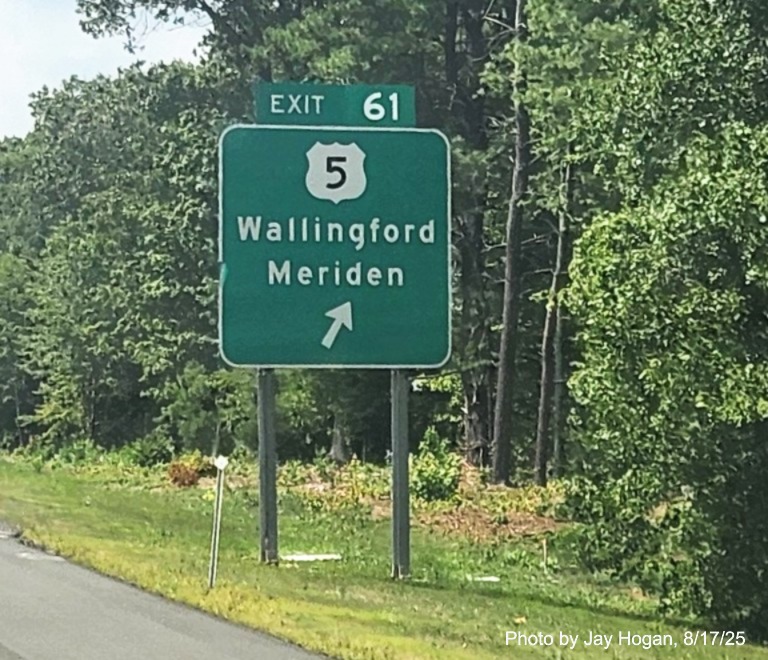 Image of ground mounted ramp sign for the US 5 exit, with
 new milepost based exit number overlay on exit tab on CT 15 South/Cross Parkway in Wallingford, 
 by Jay Hogan, August 2025