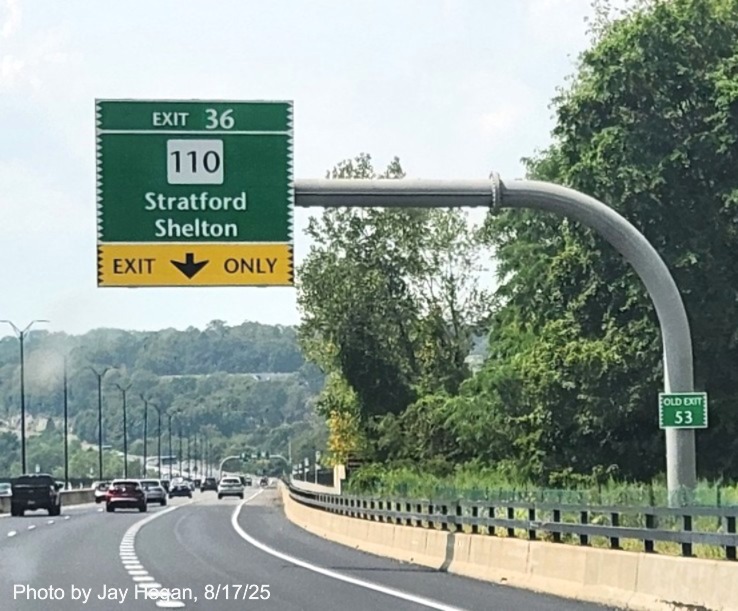 Image of 1 mile advance overhead sign for the CT 110 exit, with new milepost based exit 
 number and Old Exit 53 sign on support post on CT 15 South/Cross Parkway in Milford, by Jay Hogan, August 2025