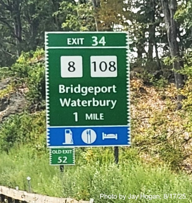 Image of 1 mile advance sign for the CT 8/108 exit, with new milepost based exit 
 number and Old Exit 52 sign on support post on CT 15 South/Merritt Parkway in Stratford, by Jay Hogan, August 2025
