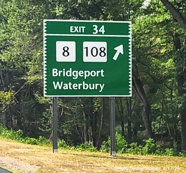 Image of 1 mile advance sign for the CT 8/108 exit, with new milepost based exit 
 number and Old Exit 52 sign on support post on CT 15 South/Merritt Parkway in Stratford, by Jay Hogan, August 2025