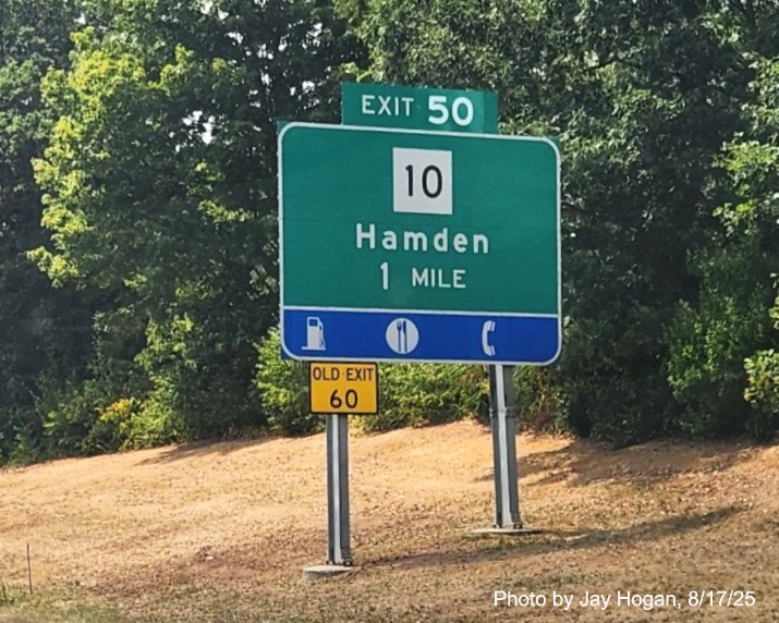 Image of 1 mile advance ground mounted sign for the CT 10 exit, with 
 new milepost based exit number with yellow Old Exit 60 sign on support post on CT 15 South/Cross Parkway in Hamden, 
 by Jay Hogan, August 2025