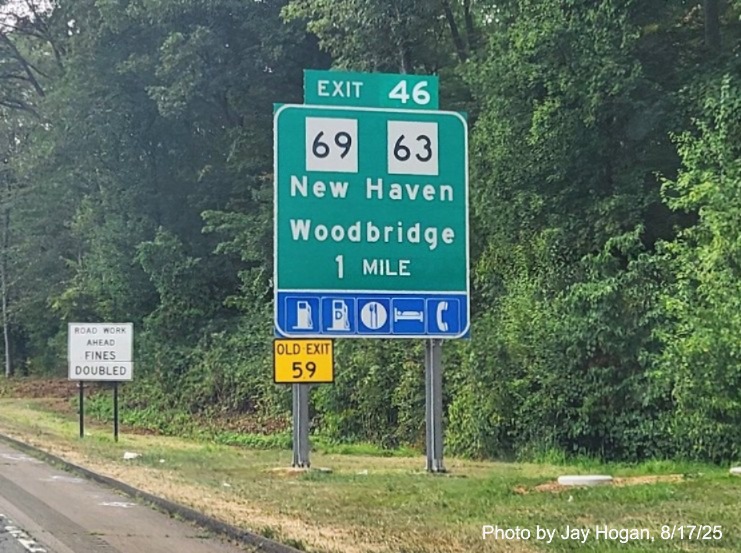 Image of 1 mile advance ground mounted sign for the CT 69/CT 63 exit, with 
 new milepost based exit number on CT 15 South/Cross Parkway in Westville, by Jay Hogan, August 2025