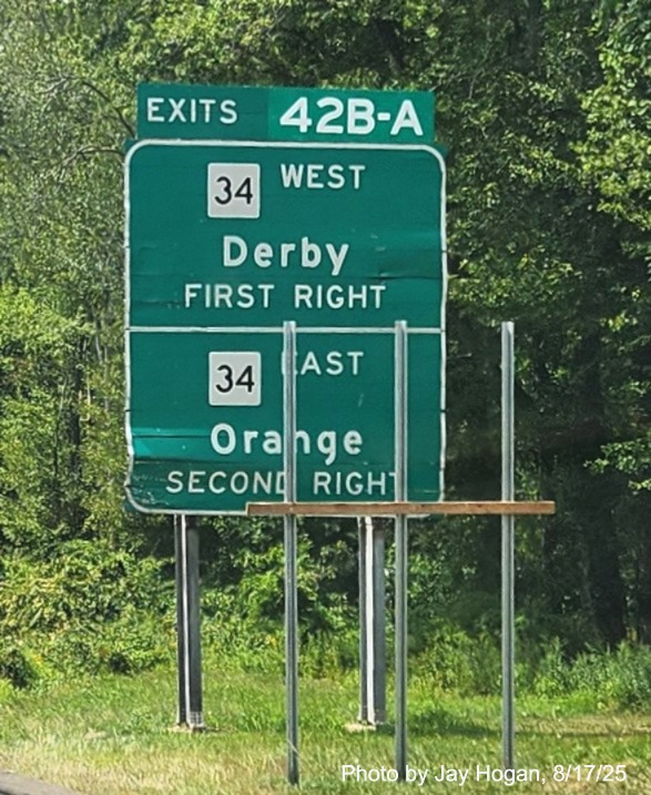 Image of 1 mile advance ground mounted sign for the CT 34 exit, with 
 new milepost based exit number on CT 15 South/Cross Parkway in Derby, by Jay Hogan, August 2025