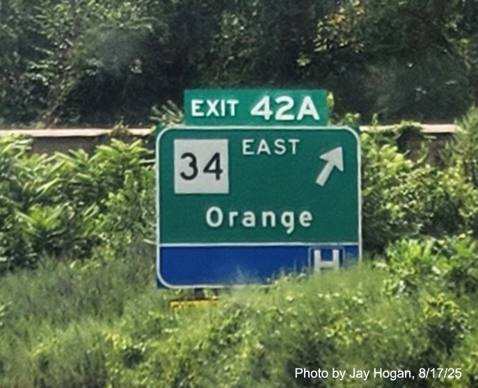 Image of ground mounted exit sign for the CT 34 East exit, with 
 new milepost based exit number on CT 15 South/Cross Parkway in Derby, by Jay Hogan, August 2025