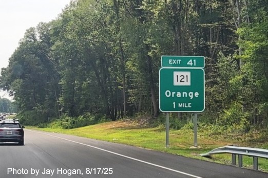 Image of 1 mile advance ground mounted sign for the CT 121 exit, with 
 new milepost based exit number on CT 15 South/Cross Parkway in Orange, by Jay Hogan, August 2025