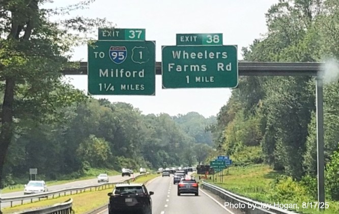 Image of 1 1/4 miles advance overhead sign for the To I-95/US 1 exit, with new milepost 
 based exit number and Old Exit 53 sign on support post on CT 15 South/Cross Parkway in Milford, by Jay Hogan, August 2025