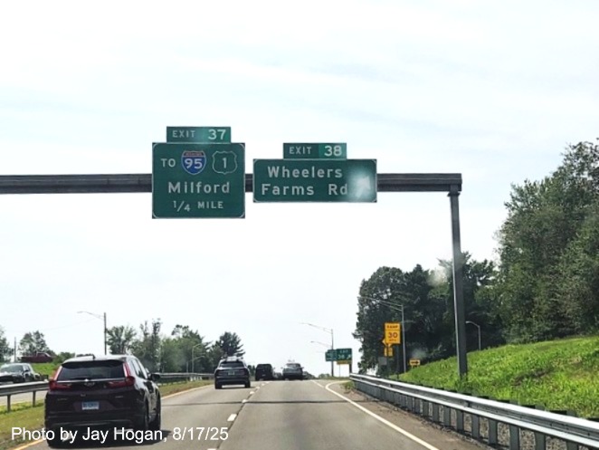 Image of 1 1/4 miles advance overhead sign for the To I-95/US 1 exit, with new milepost 
 based exit number and Old Exit 53 sign on support post on CT 15 South/Cross Parkway in Milford, by Jay Hogan, August 2025