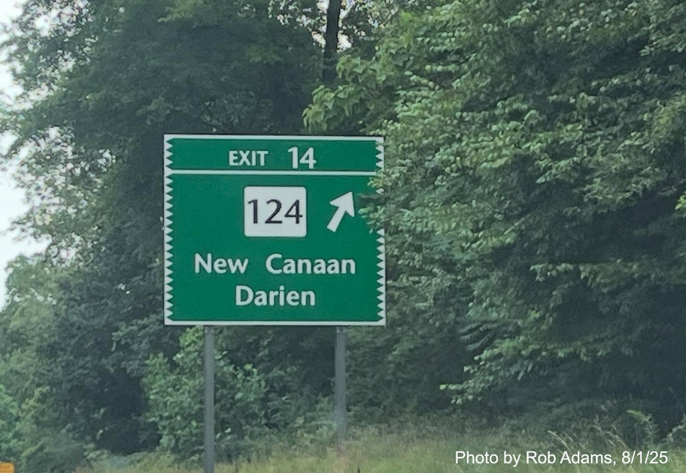 Ground mounted ramp sign for the CT 124 exit, now with new milepost based exit number 
 on CT 15 North/Merritt Parkway in New Canaan