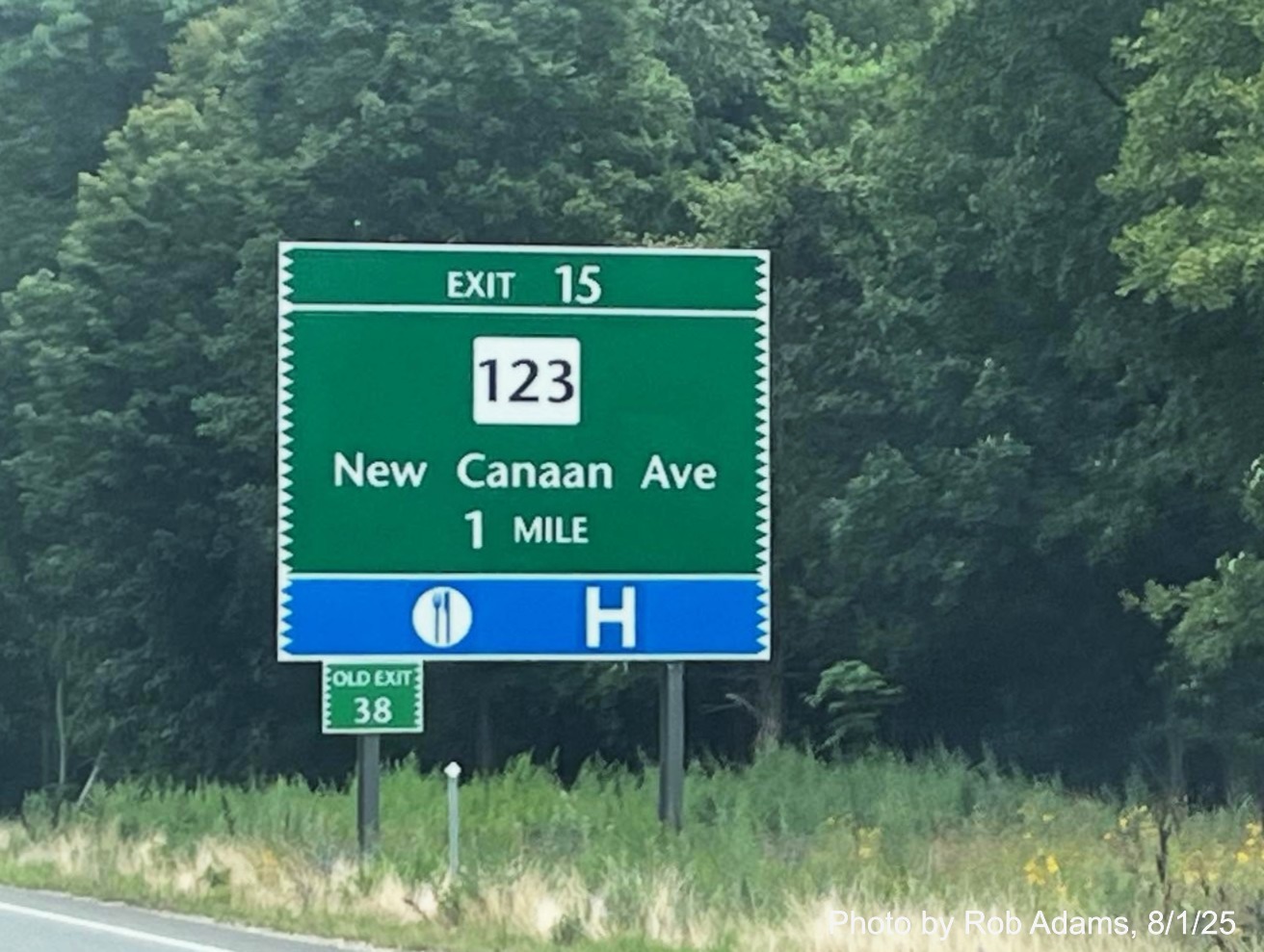 Image of 1 Mile advance sign for the CT 123 exit, now with new milepost based exit number 
 and small Old Exit 38 sign on support post on CT 15 North/Merritt Parkway in Norwalk