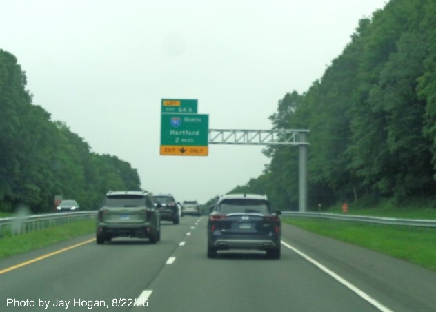 Image of new 2 Miles advance overhead sign for the I-91 North exit, with new milepost 
 based exit number on CT 15 North/Cross Parkway in Meriden, Jay Hogan, August 2026