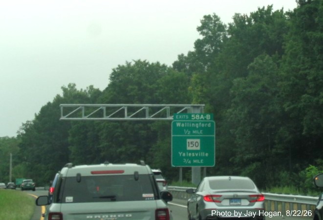 Image of new overhead sign gantry behind current overheads at the Wallingford exit, with 
 new milepost based exit number on CT 15 North/Cross Parkway, Jay Hogan, August 2026