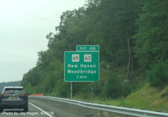 Image of new ground mounted 1 mile advance sign for the CT 69/63 East exit, with new milepost 
 based exit number on CT 15 North/Cross Parkway in Woodbridge, Jay Hogan, August 2026