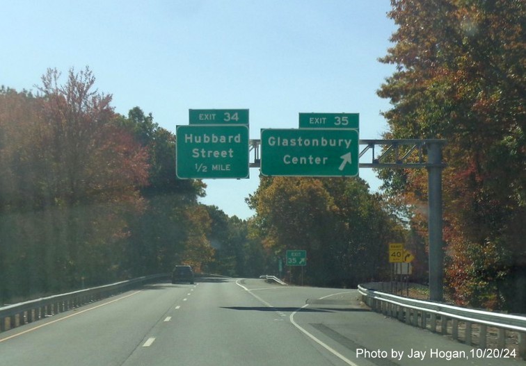 Image of new 1/2 mile advance overhead sign for Hubbard Street exit with new milepost based exit number
        at ramp for Glastonbury exit on CT 17 South, by Jay Hogan, October 2024