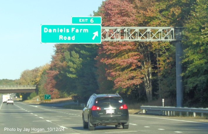 Image of 1/2 mile advance overhead sign with new milepost based exit number and yellow Old Exit 8 sign attached to support post on CT 25 North in Bridgeport, by Jay Hogan, October 2024