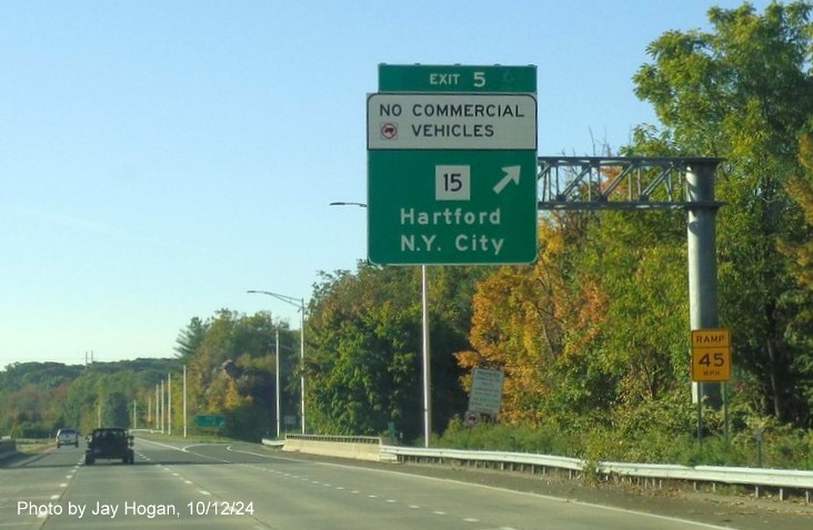 Image of overhead ramp sign with new milepost based exit number for CT 15 exit on CT 25 South in Trumbull, 
     by Jay Hogan, October 2024