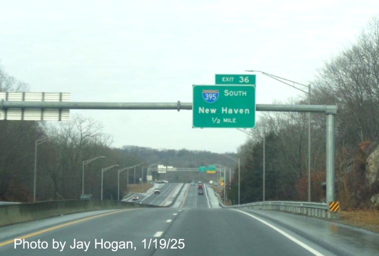 Image of 1 Mile advance overhead sign for I-395 South exit with new milepost based
	  exit number on CT 2 West in Norwich, by Jay Hogan, January 2025