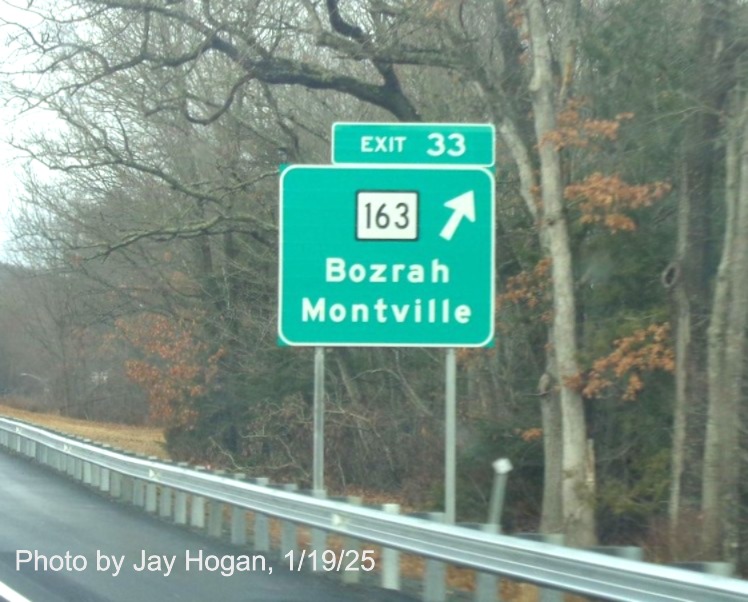 Image of ground mounted ramp sign for CT 163 exit with new milepost based
	  exit number on CT 2 West in Bozrah, by Jay Hogan, January 2025