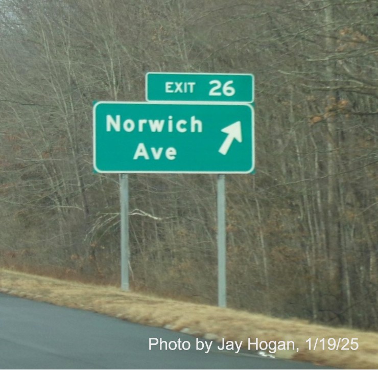 Image of ground mounted ramp sign for Norwich Avenue exit with new milepost based
	  exit number on CT 2 West in Colchester, by Jay Hogan, January 2025