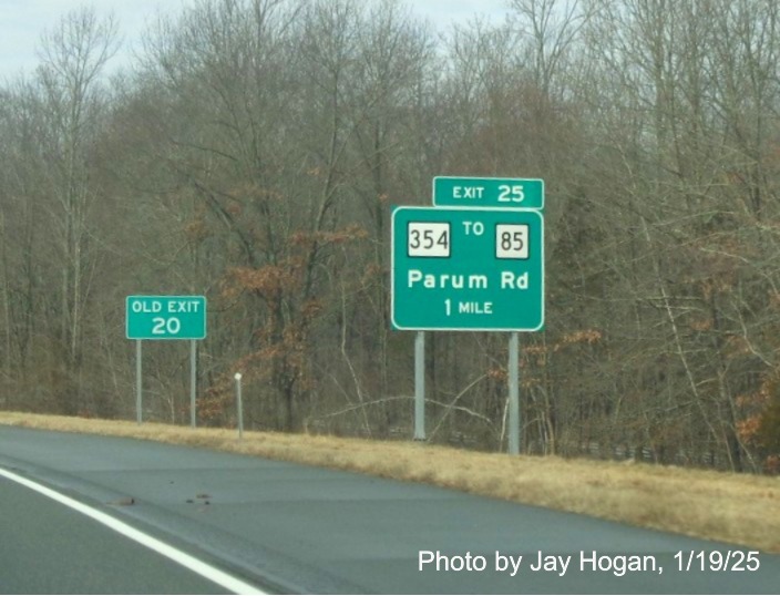 Image of ground mounted 1 mile advance sign for CT 354 exit with new milepost based
	  exit number on CT 2 West in Colchester, by Jay Hogan, January 2025