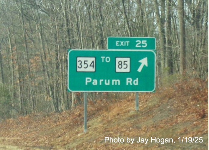 Image of ground mounted ramp sign for CT 354 exit with new milepost based
	  exit number on CT 2 West in Colchester, by Jay Hogan, January 2025