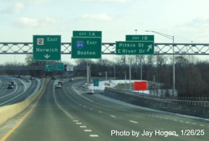 Image of renumbered advance signs for I-84 East and Pitkin Street/East River Drive across bridge on
	 CT 2 East in East Hartford, by Jay Hogan, January 2025