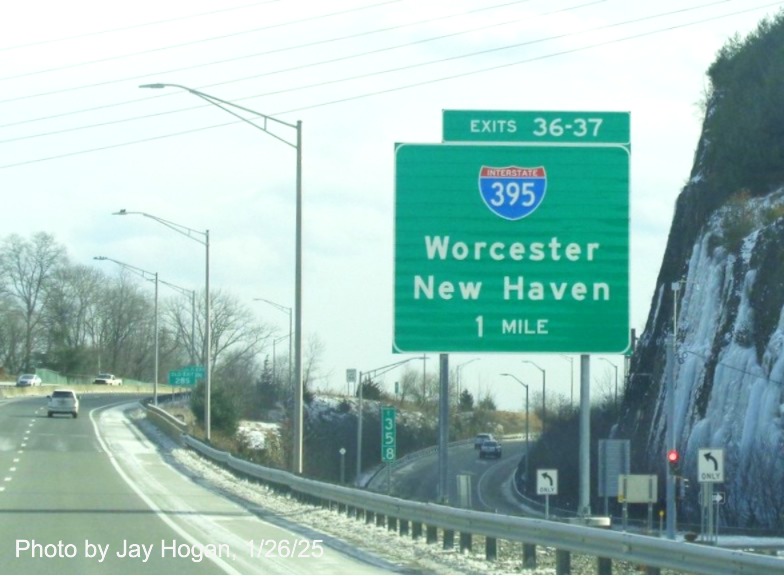 Image of ground mounted 1 Mile advance sign for I-395 exits with new milepost based
	  exit number on CT 2 East in Norwich, by Jay Hogan, January 2025