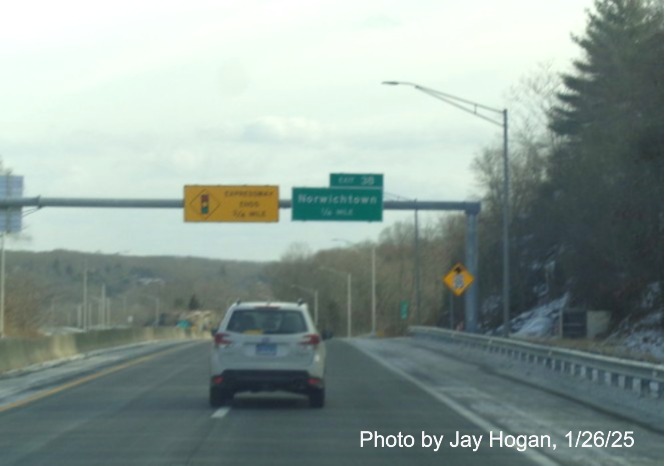 Image of 1/2 Mile advance overhead sign for Norwichtown exit with new milepost based
	  exit number on CT 2 East in Norwich, by Jay Hogan, January 2025