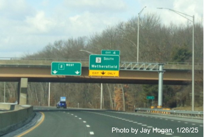 Image of overhead ramp sign for CT 3 exit with new milepost based
	  exit number on CT 2 West in Glastonbury next to old CT 2 pull through sign, by Jay Hogan, January 2025