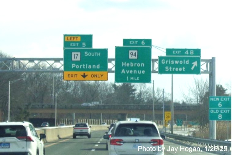 Image of overhead ramp sign for Griswold Road exit with new milepost based
	  exit number on CT 2 East in Glastonbury, by Jay Hogan, January 2025