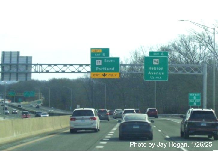 Image of 1/2 mile advance left exit sign for CT 17 with new milepost based
	  exit number on CT 2 East in Glastonbury, by Jay Hogan, January 2025