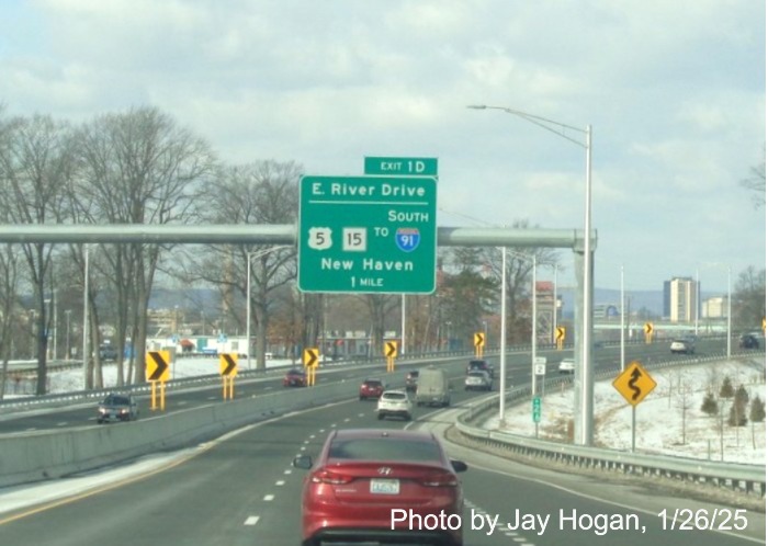 Image of 1 Mile advance sign for US 5/CT 15 to I-91 South exit with new milepost based exit number on CT
	2 West in East Hartford, by Jay Hogan, January 2025