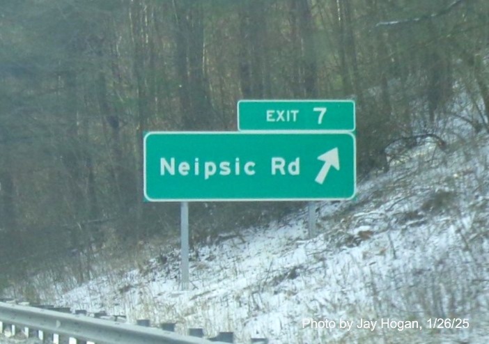 Image of ground mounted ramp sign for Neipsic Road exit with new milepost based
	  exit number on CT 2 East in East Glastonbury, by Jay Hogan, January 2025