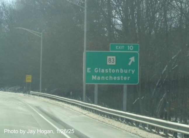 Image of ground mounted ramp sign for CT 83 with milepost based
	  exit number that matches old number on CT 2 East in East Glastonbury, by Jay Hogan, January 2025