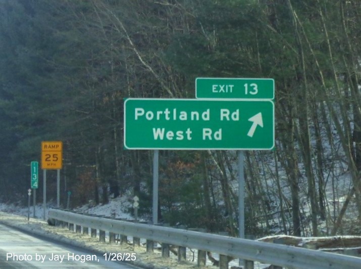 Image of ground mounted ramp sign for Portland Road/West Road exit with new milepost based
	  exit number on CT 2 East in Marlborough, by Jay Hogan, January 2025