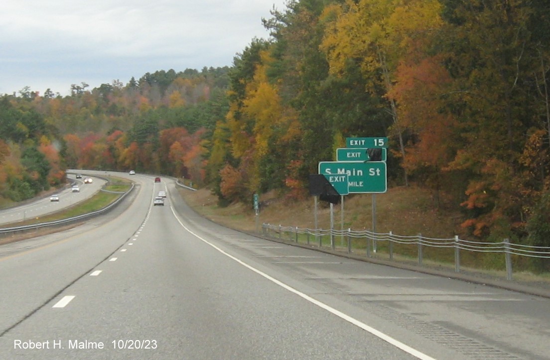 Image of recently placed 1 mile advance sign for South Main Street exit on CT 2 West with covered over
      future milepost exit number ( ) and Old Exit 15 sign, October 2023