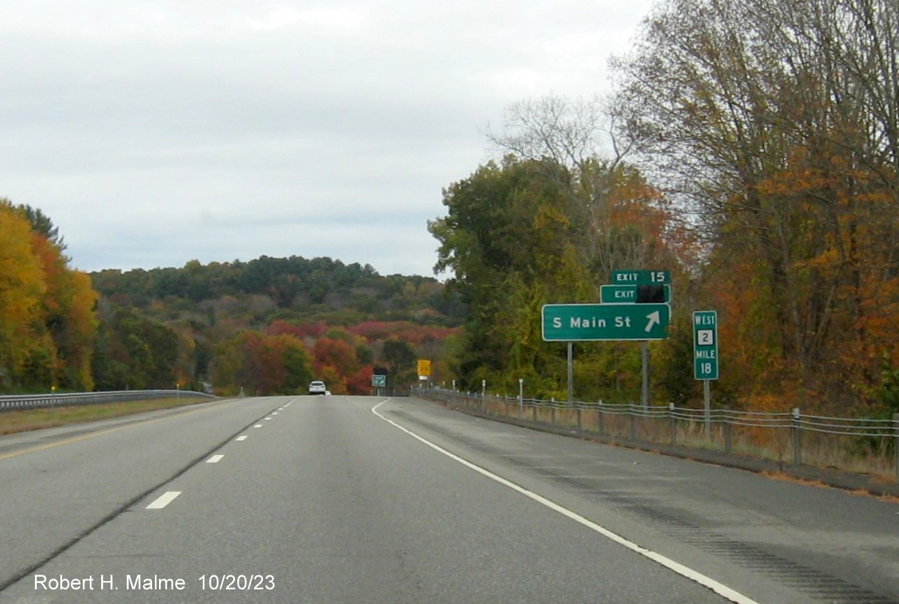 Image of recently placed ground mounted ramp sign for South Main Street exit on CT 2 West, with future exit
      number covered over, October 2023