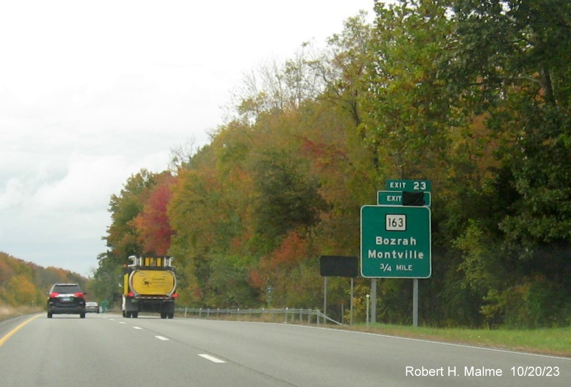 Image of new 3/4 mile advance sign for CT 163 exit on CT 2 West on CT 32 in Bazrah with covered 
      over future exit number (33) and also Old Exit 23 sign, October 2023