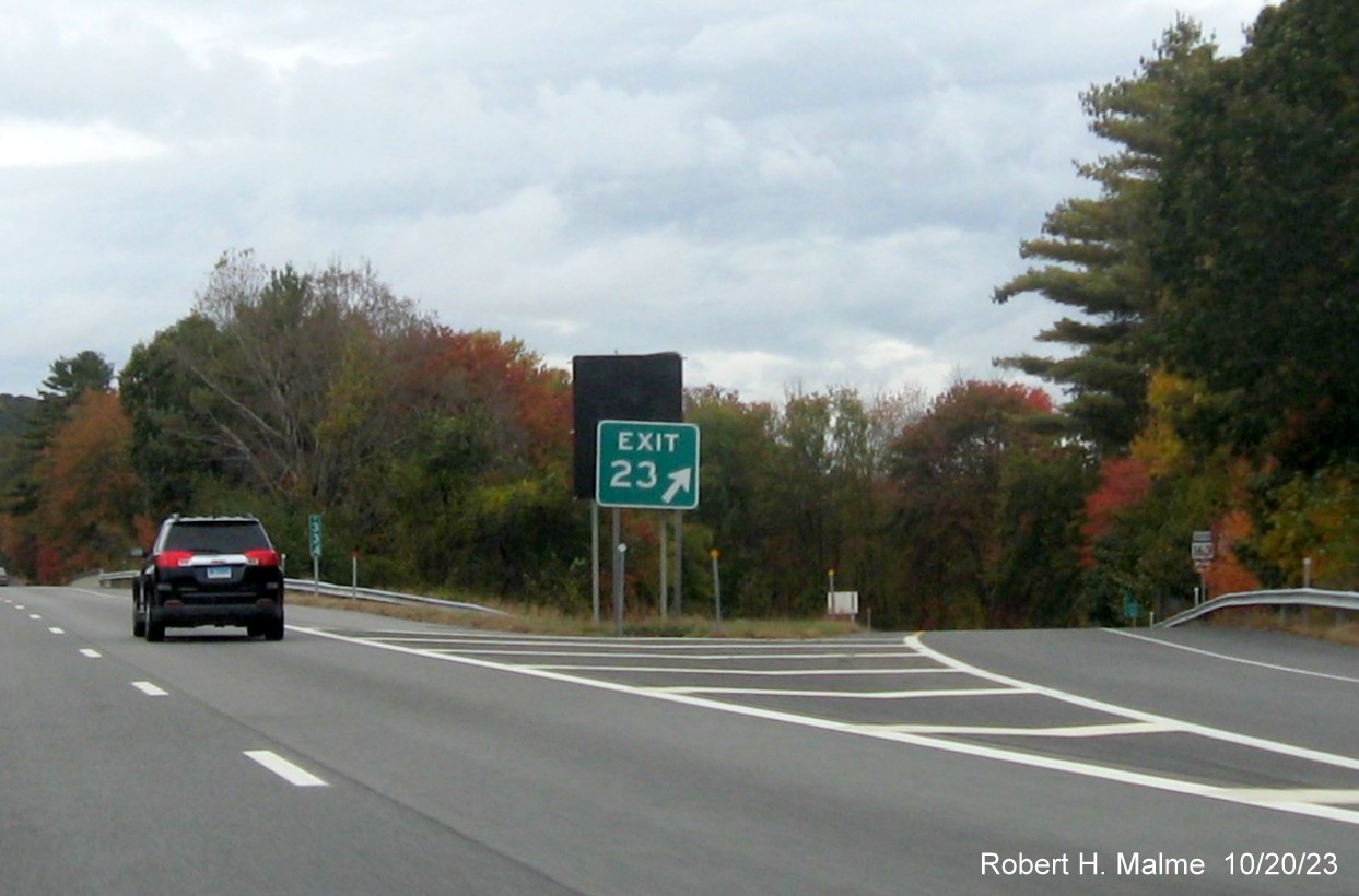 Image of old gore sign for CT 163 exit in front of new one on CT 2 West in Bazrah with covered 
      over future exit number and Old Exit 23 sign, October 2023