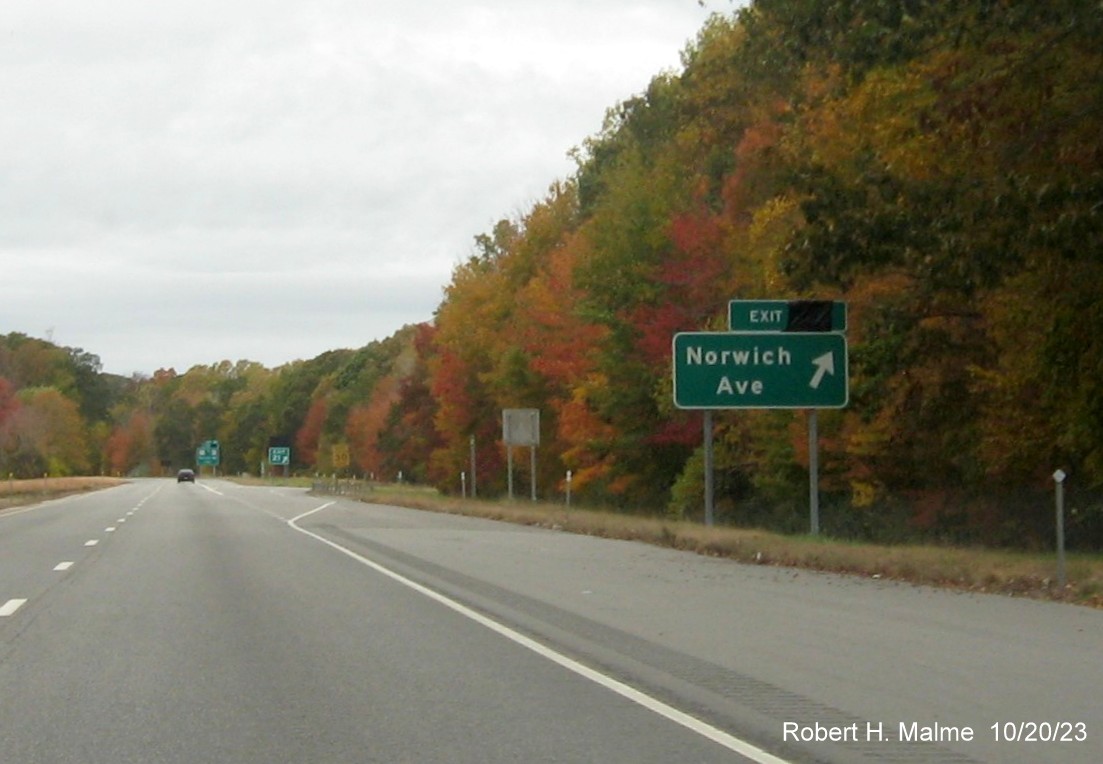 Image of new ground mounted ramp sign for Norwich Avenue exit on CT 2 West in Colchester with covered 
      over future exit number, October 2023