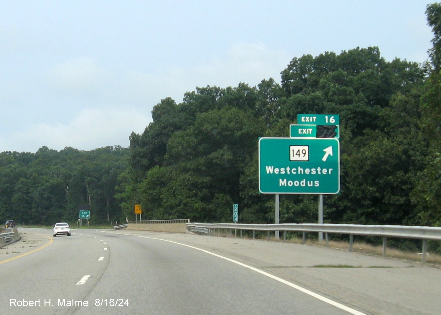 Image of ramp sign for CT 149 exit still with covered over future milepost based exit number 
       on CT 2 West in Hebron, August 2024