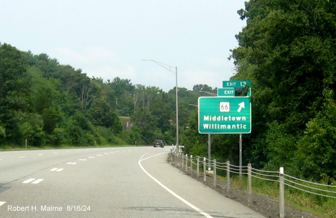 Image of ramp sign for CT 66 exit still with covered over future milepost based 
       exit number on CT 2 West in Marlborough, August 2024