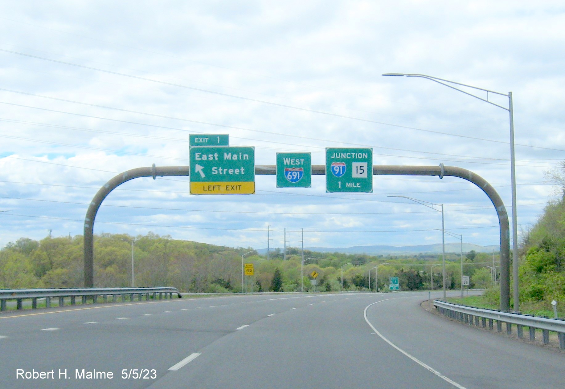 Image of overhead ramp sign for East Main Street exit with new milepost based exit number on CT 66 West in Meriden, May 2023