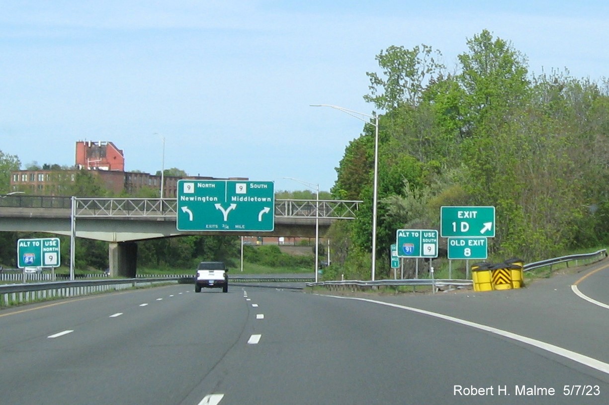 Image of gore sign for Downtown New Britain exit with new milepost based exit number and Old Exit 8 sign below on CT 72 East, May 2023