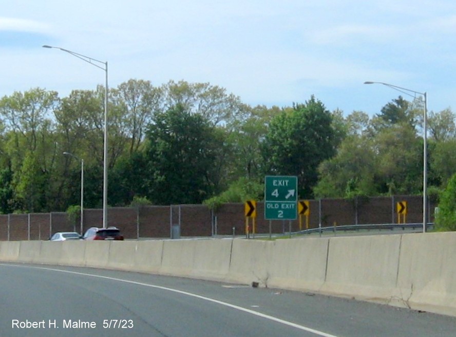 Image of overhead ramp sign for CT 322 exit with new milepost based exit number on CT 72 West in Bristol, May 2023